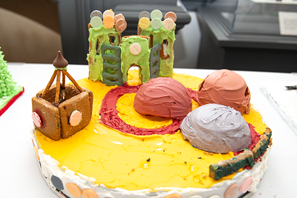 A gingerbread recreation of Watkins Park. There are gingerbread and pretzel jungle gyms, forts, and the playful huts covered in icing.