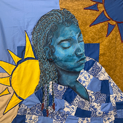A brightly colored, quilted artwork in shades of yellow and blue depicting a woman with her eyes closed.