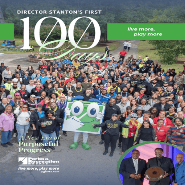 The cover of a publication, with the words DIRECTOR STANTON'S FIRST 100 DAYS across the top, and an image of a crowd gathered around a person in a green and white mascot costume. At the bottom left are the words A New Era of Purposeful Progress above the Parks and Recreation logo. In the bottom right corner is an inset photo of three men in suits posing with a circular medallion award.