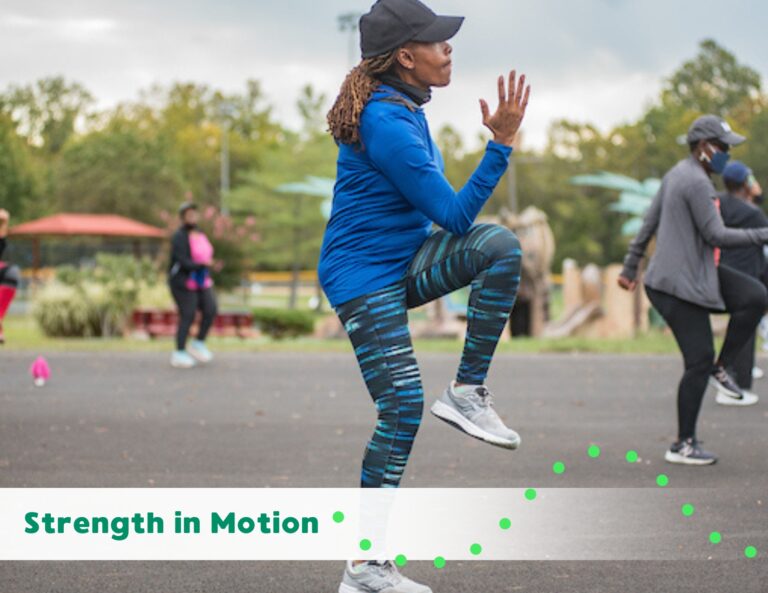 Participant performs a high-knee exercise during an outdoor fitness class promoting strength and movement.